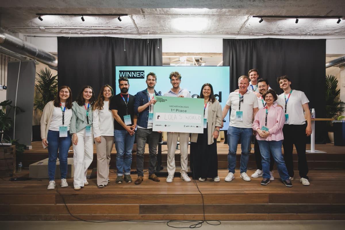 1st Place at Unicorn Factory Lisbon — team on stage with winner check